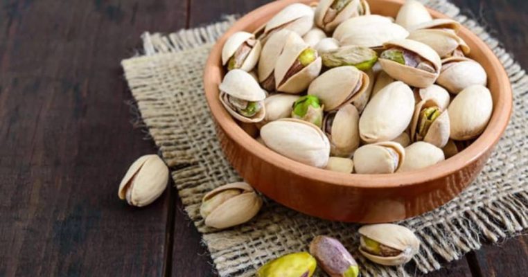 A bowl of green treasures, cracked with care A bowl of green treasures, cracked with care