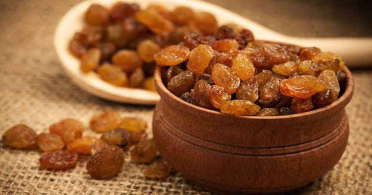 A bowl full of golden Kismis — naturally sweet, deliciously healthy, and sun-kissed to perfection