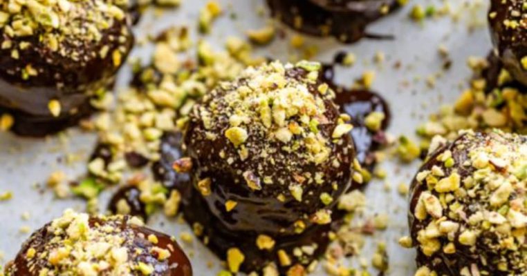 Chocolate truffles fully dressed in pistachios