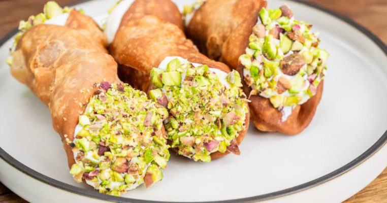 Indulge in the creamy delight of pistachio cannoli – a perfect bite of Italian sweetness!