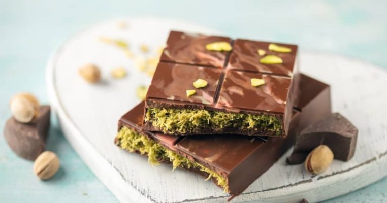 Experience the nutty delight of pistachios wrapped in creamy chocolate bliss